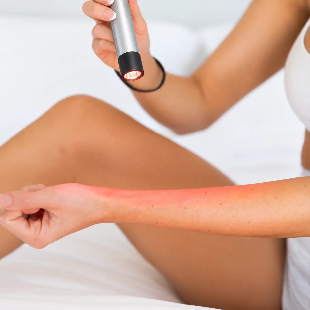 Targeted application of the Buudy LED Torch on forearm and wrist joint for localized pain relief and cellular repair